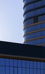 City view, modern buildings and skyscrapers against the blue sky.