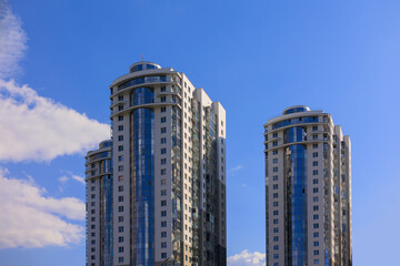 Cityscape on a summer day, modern buildings and houses 