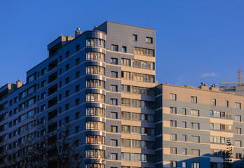 Cityscape on a summer day, modern buildings and houses 