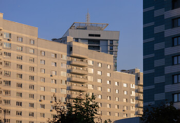 Cityscape on a summer day, modern buildings and houses 
