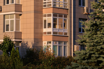 Cityscape on a summer day, modern buildings and houses 