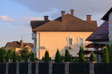 Cityscape on a summer day, modern buildings and houses 