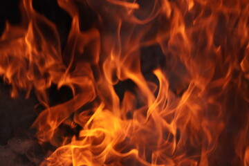 Fire blaze flames on black background. Fire burn flame isolated, abstract texture. Flaming explosion effect with burning fire
