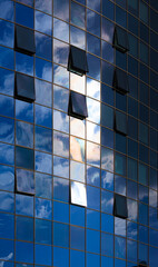 Cityscape on a summer day, modern buildings and houses 