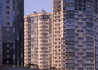Cityscape on a summer day, modern buildings and houses 