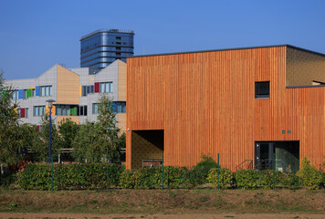 Fototapeta premium Cityscape on a summer day, modern buildings and houses 