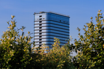 City view, modern buildings and skyscrapers against the blue sky.