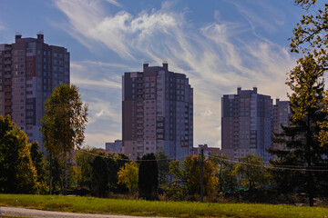 Obraz premium Cityscape on a summer day, modern buildings and houses 