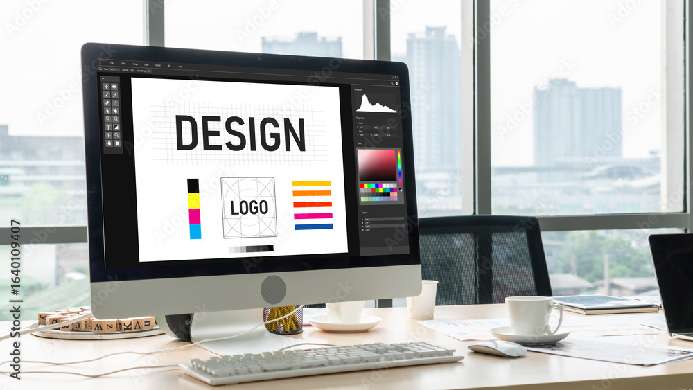 Poster graphic designer software for modern design of web page and commercial ads showing on the computer s