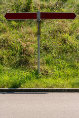 Which way to go? Crossroad with a two guidepost, one points to the left, one to the right side.....