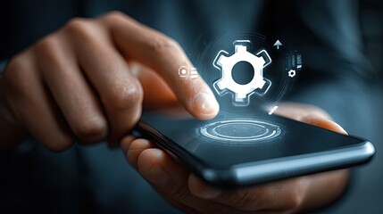 Hands touching smartphone screen displaying futuristic interface with gear icon, symbolizing innovation and digital transformation in technology.