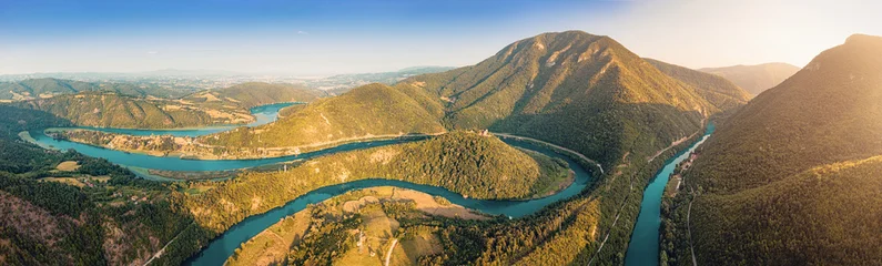 Fototapete Gebirgsfluss Aerial view of a Western Morava winding river snaking through a picturesque Ovcar Kablar valley, surrounded by lush green mountains in Serbia  © EdNurg