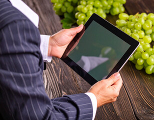 man holding a tablet with a green screen