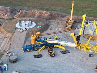 Construction of a large crane for the construction of a wind turbine tower, aerial photograph,...