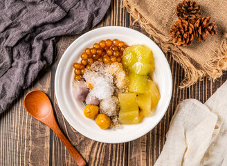 Taiwanese Shaved Ice with Sweet Potato, Taro Balls, Chewy Pearls, and Rice Noodles in bowl top view of Taiwan food