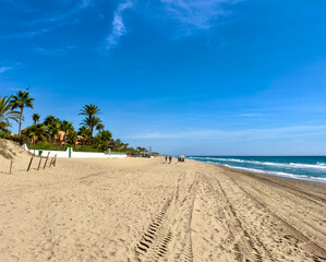 sandy beach Playa los Monteros at the Mediterranean Sea near Marbella, view along the Costa del Sol in the summer, Andalusia, Spain