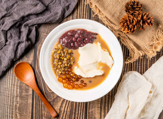 Tofu Pudding with Pearl Milk Tea, Red Beans, Mung Beans, and Tapioca Pearls in bowl top view of Taiwan food