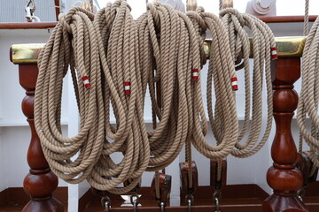  Weathered Nautical Rope Tied to a Cleat on a Wooden Ship