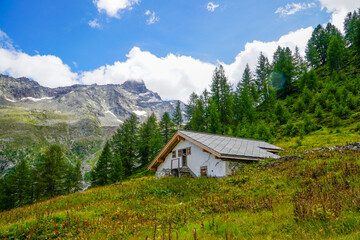 Saas-Fee Alpine Chalet in Summer Mountain Landscape