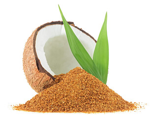 Half of coconut, green palm leaves and brown coconut sugar isolated on a white background. Healthy...