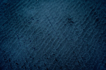 Surreal abstract sand textures and patterns on Miramar Beach, Goa, captured in the evening light.