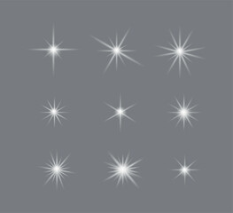  Collection of glowing white star sparkles on a gray background, ideal for festive decorations, digital art, light effects, celebration graphics, and magical visual enhancements.