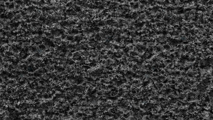 Fototapeta premium Black rough textured surface background for web banner page template design. creates oppressive and somewhat gloomy mood.