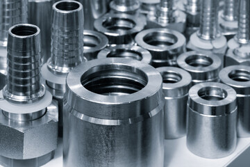 Collection of various sized metal pieces with a silver color. The pieces are arranged in a way that...