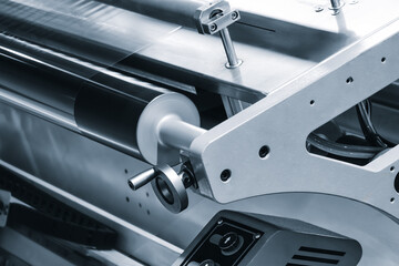 Automatic industrial machine for producing polyethylene bags or packaging products in plastic film. Automatic packaging of products and food products concept.