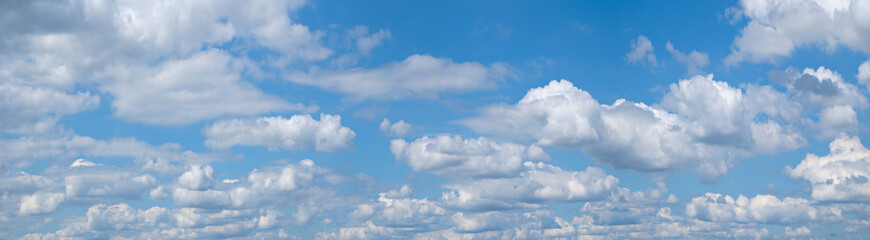 wide panorams of heaven sky is blue with many clouds. clouds are scattered throughout the sky and are of various sizes.