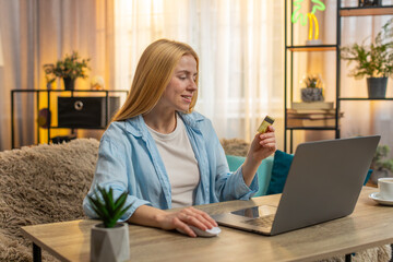 Woman clicks purchase at home, moving items to cart and typing credit card data on laptop with...