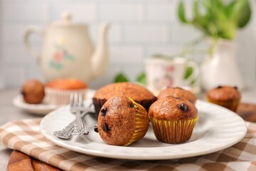 Tea time Banana cup cake with fork in white plate