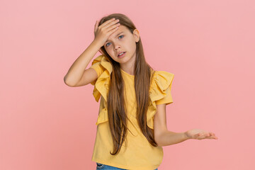 Young child girl performs a facepalm gesture to express shame or playful frustration, mimicking a...