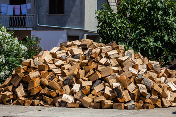 Heap of fire woods on street in city