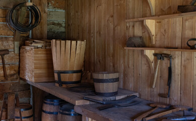 Traditional Cooperage Workshop with Wooden Barrels and Tools