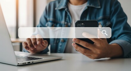 A person using a laptop and smartphone with a graphical search bar in the foreground.