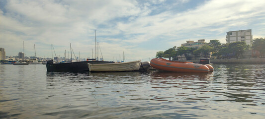 Urca neighborhood hill beach sea ocean deck texture pattern stone wall wood shell boat dinghy sailboat landscape happy life beautiful pleasant comfort vacation buoy sun cloud blue sky reflection shine