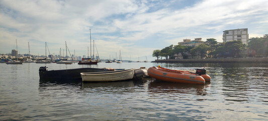 Urca neighborhood hill beach sea ocean deck texture pattern stone wall wood shell boat dinghy sailboat landscape happy life beautiful pleasant comfort vacation buoy sun cloud blue sky reflection shine