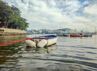 Urca neighborhood hill beach sea ocean deck texture pattern stone wall wood shell boat dinghy sailboat landscape happy life beautiful pleasant comfort vacation buoy sun cloud blue sky reflection shine