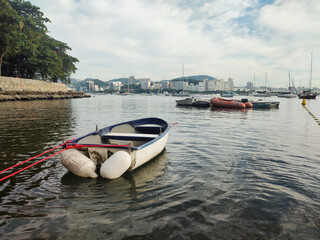 Urca neighborhood hill beach sea ocean deck texture pattern stone wall wood shell boat dinghy sailboat landscape happy life beautiful pleasant comfort vacation buoy sun cloud blue sky reflection shine