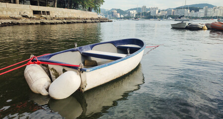 Urca neighborhood hill beach sea ocean deck texture pattern stone wall wood shell boat dinghy sailboat landscape happy life beautiful pleasant comfort vacation buoy sun cloud blue sky reflection shine