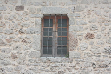 window in stone wall