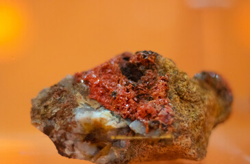 Vibrant red mineral specimen on display