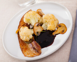 Cauliflower with bacon and mushrooms