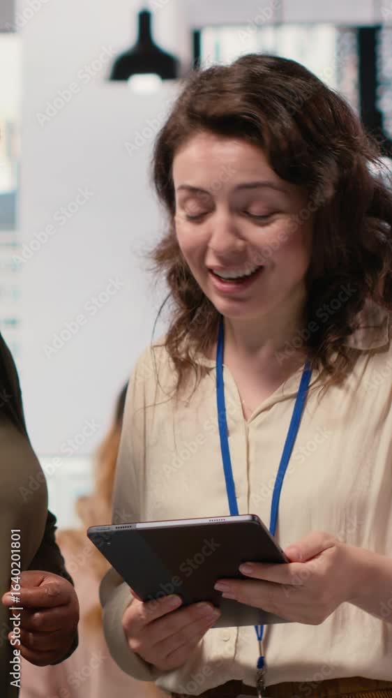 Poster vertical video diverse management staff reviewing advanced ai algorithms and predictive models to en