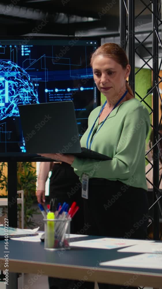 Poster vertical video female entrepreneur works with neural networks for analytics, looking at ai automatio