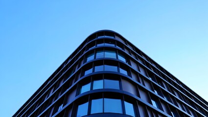 Modern architecture building exterior design with blue sky and glass windows view