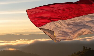 Waving flag at sunrise over clouds