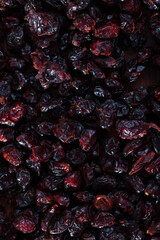 Dehydrated blueberries on wood surface. Natural food background