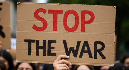 Protester Holding 'Stop The War' Sign at a Demonstration